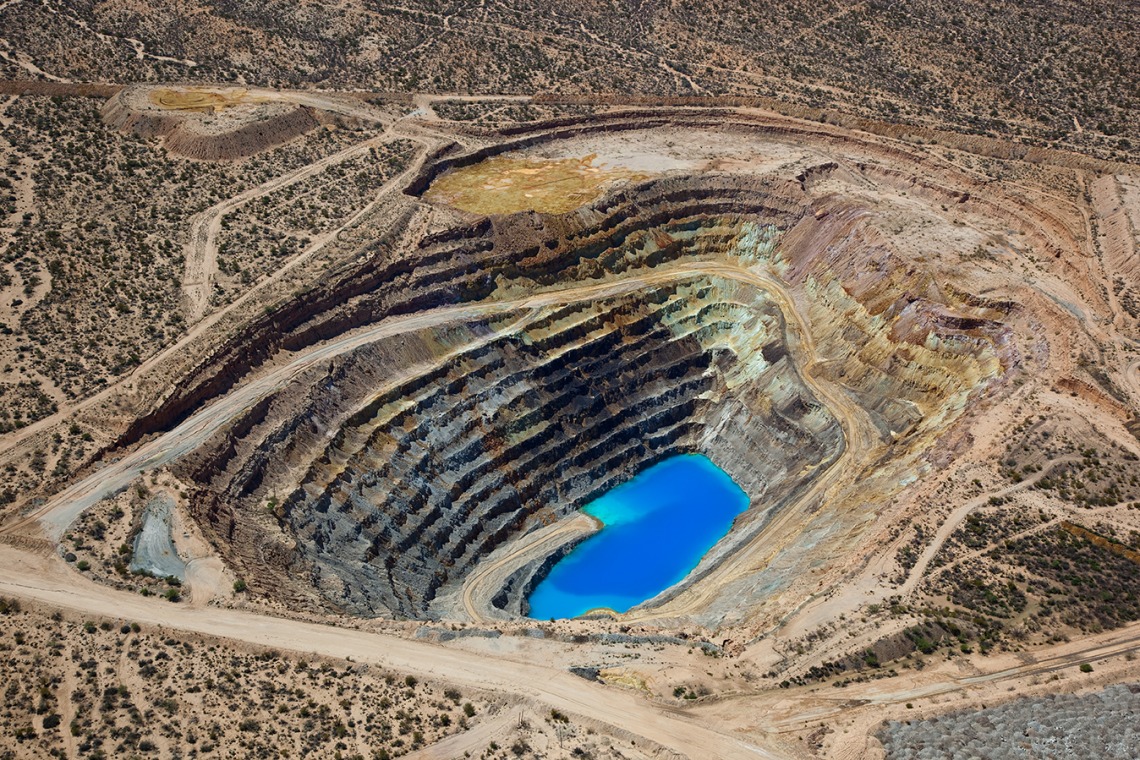 Open pit mine with water at the bottom