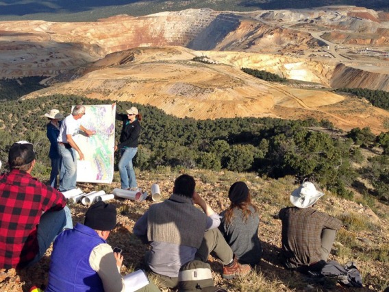 group of students at an outlook over a mine