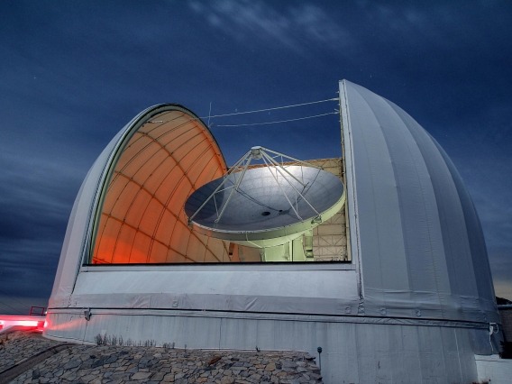 The 40-foot dish of the Arizona Radio Observatory 12-meter radio telescope on Kitt Peak is pointed at the sky, ready for a night of observing. 