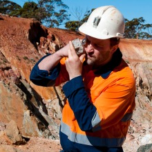 Geologist looking at sample in the field