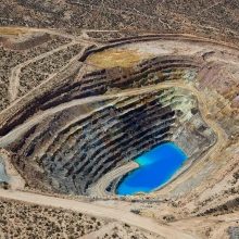 Open pit mine with water at the bottom